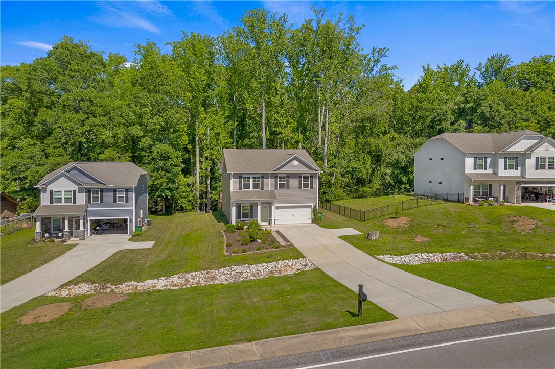 430 Johnson Road Central, SC 29630 - Photo 29 of 36 A well-maintained facade with an attached garage, offering comfortable living and excellent curb appeal.