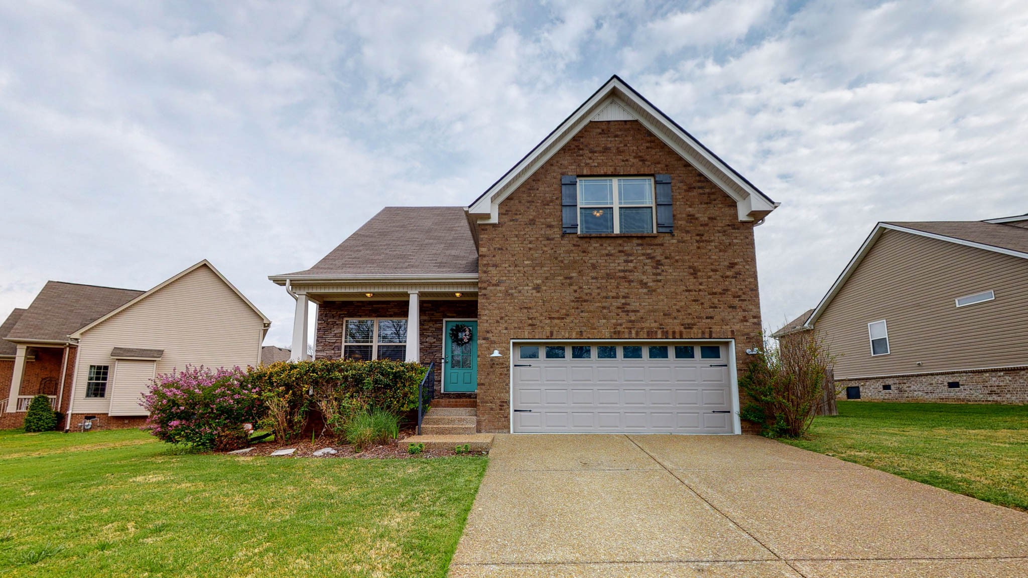 1115 Golf View Way Spring Hill, TN 37174 - Photo 1 of 49 a front view of a house with a yard