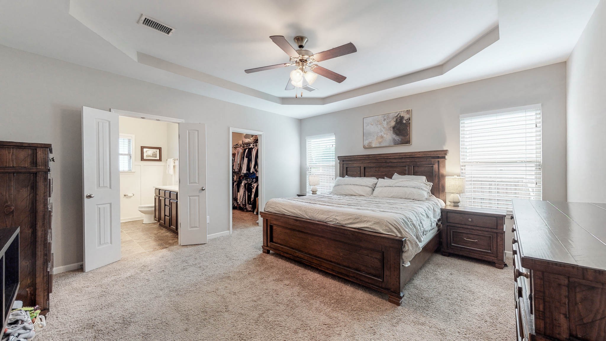 1115 Golf View Way Spring Hill, TN 37174 - Photo 17 of 49 a spacious bedroom with a bed and a ceiling fan