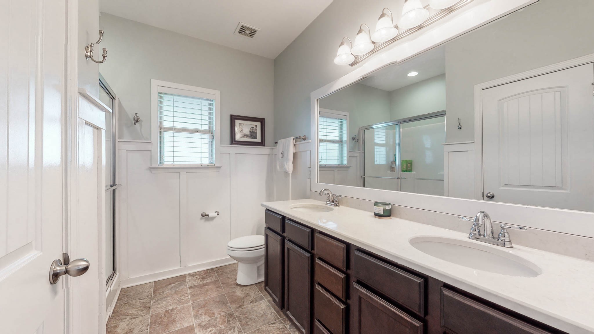 1115 Golf View Way Spring Hill, TN 37174 - Photo 22 of 49 a bathroom with a double vanity sink toilet and shower