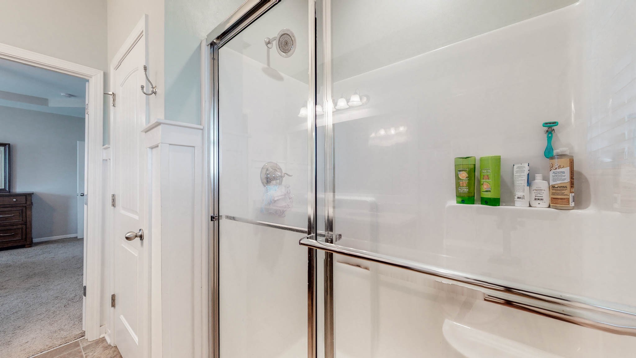 1115 Golf View Way Spring Hill, TN 37174 - Photo 24 of 49 a bathroom with a shower and a mirror