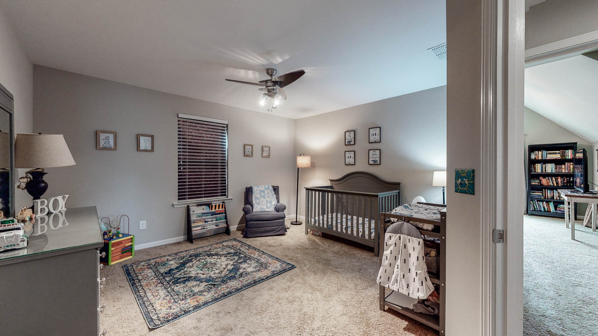 1115 Golf View Way Spring Hill, TN 37174 - Photo 33 of 49 a living room with furniture a rug and a chandelier