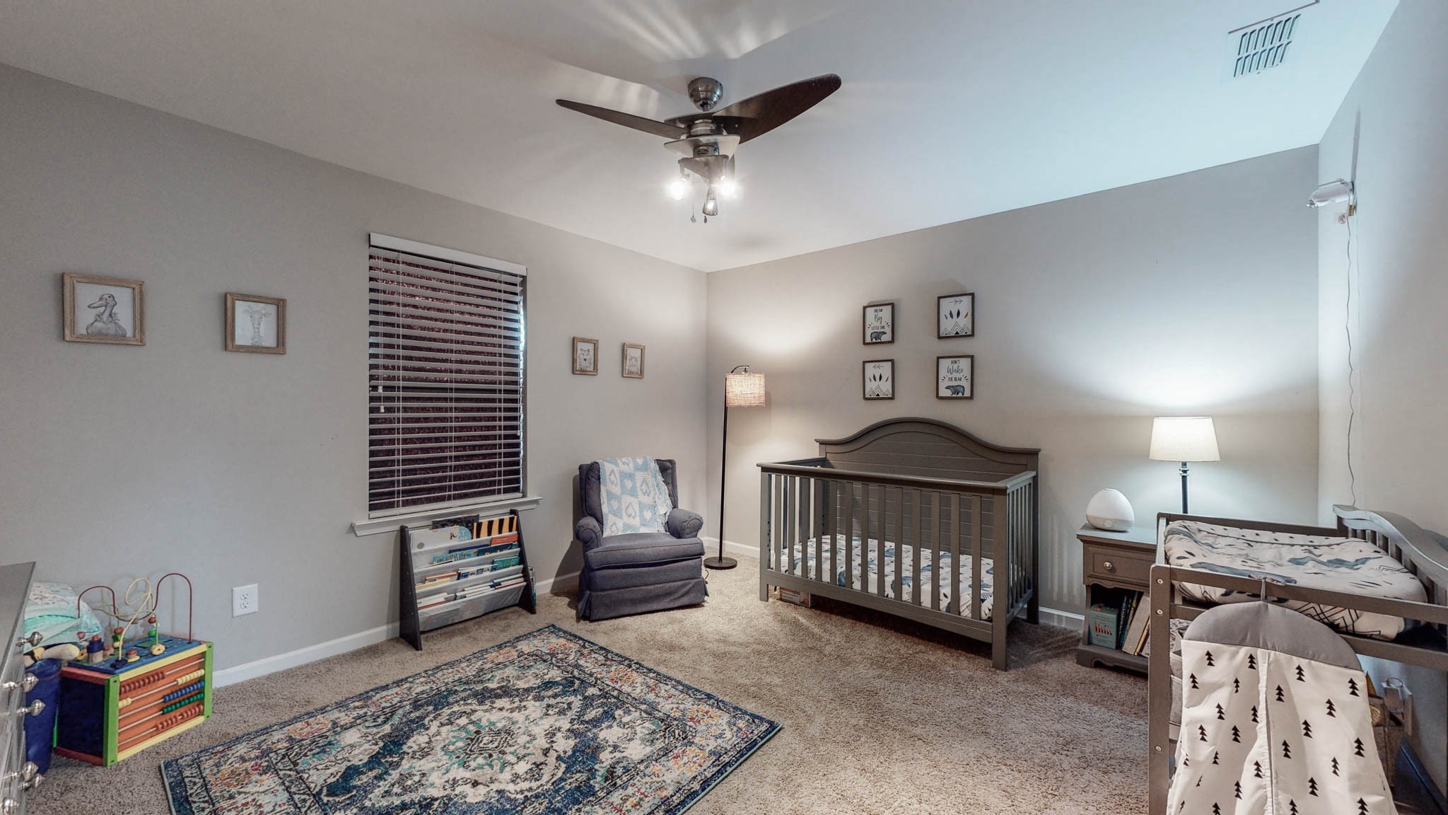 1115 Golf View Way Spring Hill, TN 37174 - Photo 34 of 49 a bedroom with furniture and a window