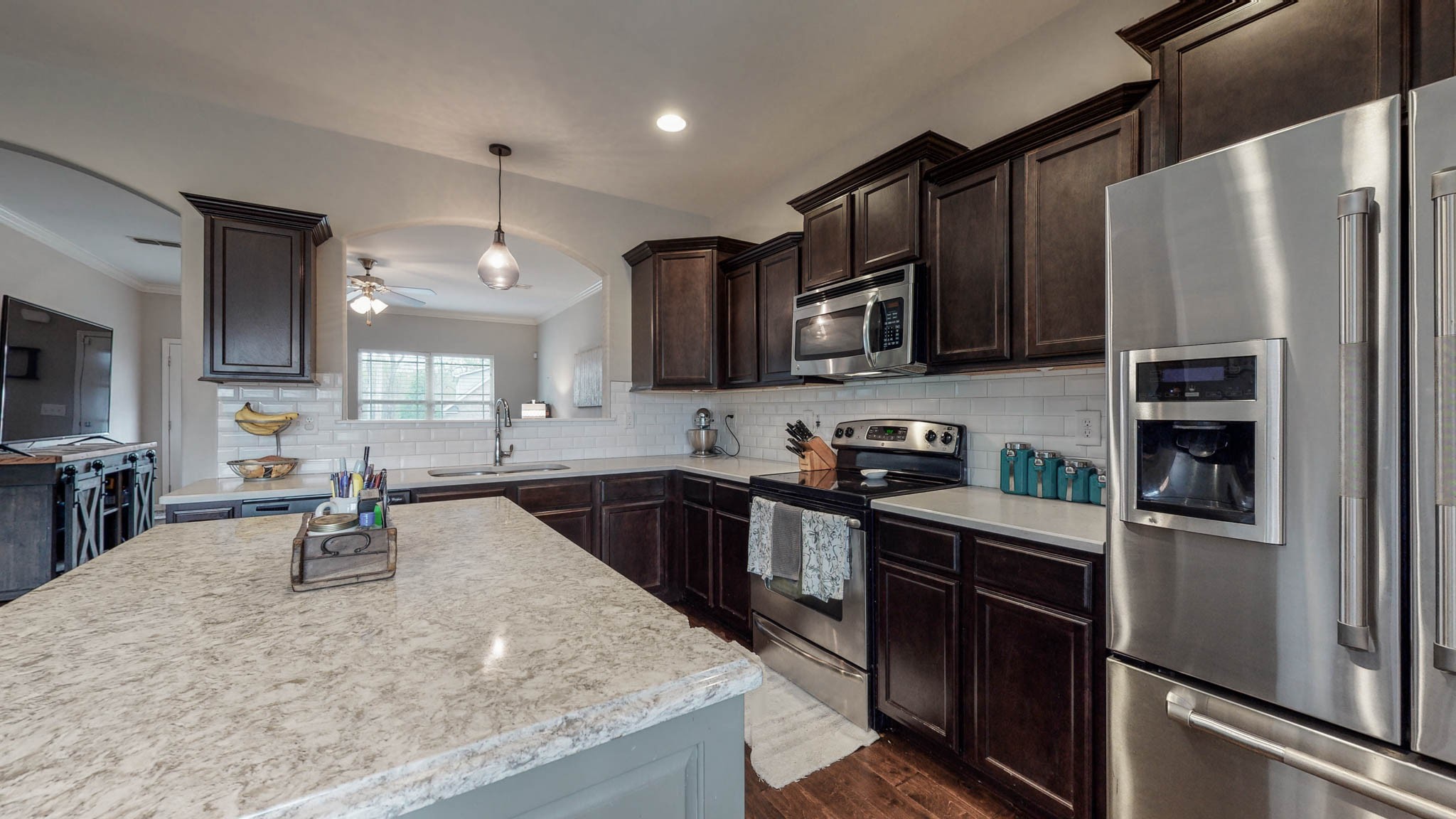 1115 Golf View Way Spring Hill, TN 37174 - Photo 10 of 49 a kitchen with stainless steel appliances granite countertop a refrigerator stove microwave and sink