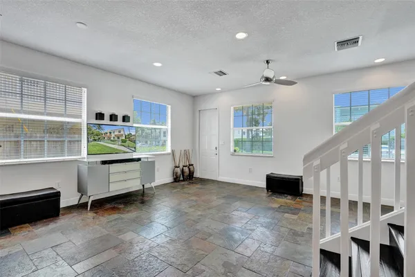 a view of workspace with furniture and window
