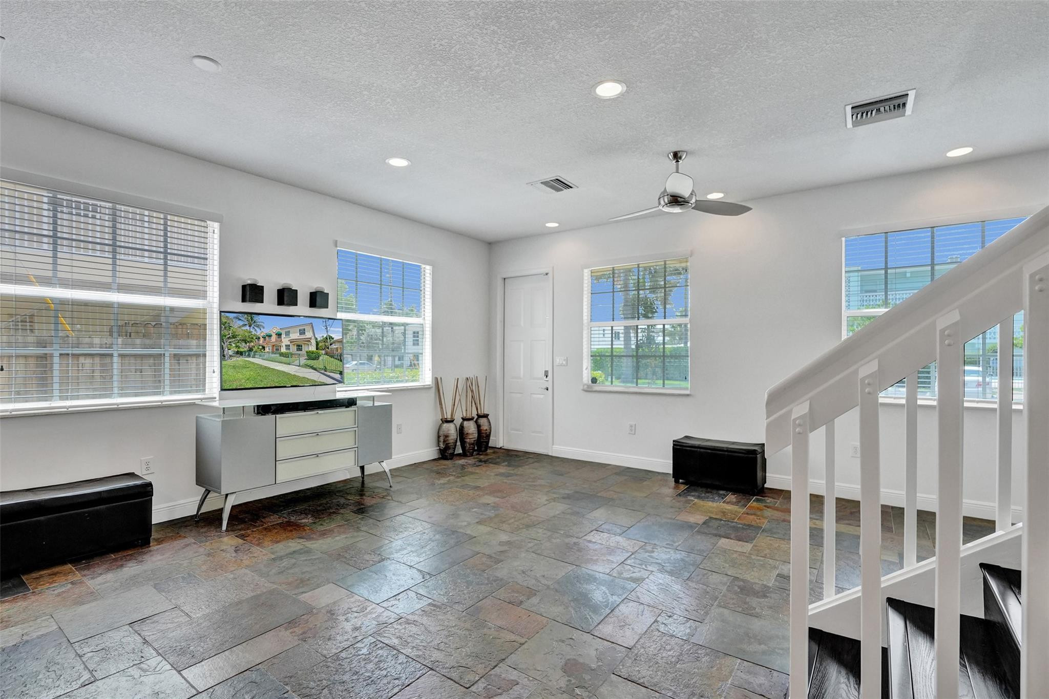a view of workspace with furniture and window