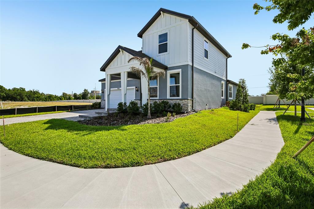 9932 Redwood Rdg Avenue Riverview, FL 33578 - Photo 2 of 38 a front view of a house with a yard