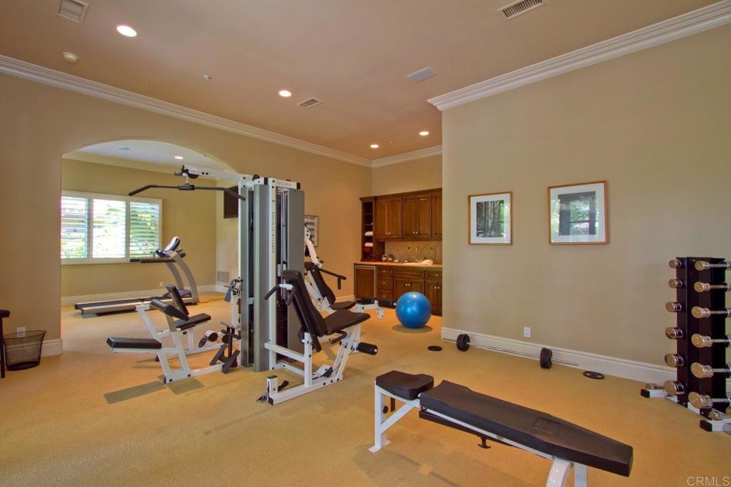 15651 Puerta Del Sol Rancho Santa Fe, CA 92067 - Photo 14 of 19 a room with gym equipment and windows
