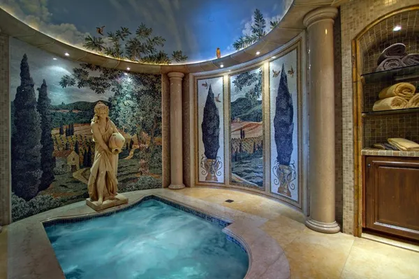 a view of a room with a table and chairs