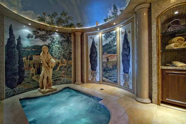 a view of a room with a table and chairs