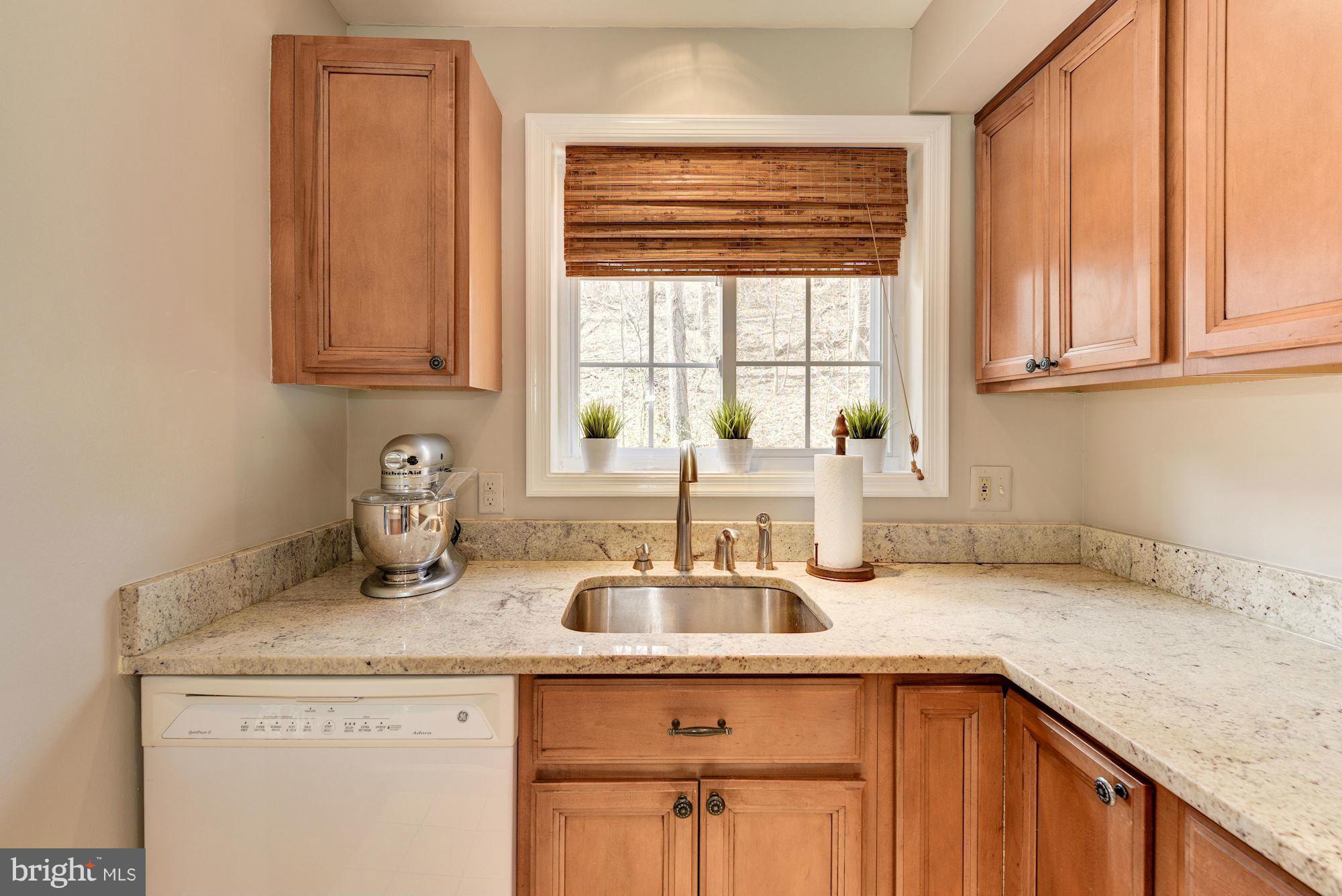 1621 Preston Road Alexandria, VA 22302 - Photo 14 of 30 a kitchen with granite countertop a sink and a window