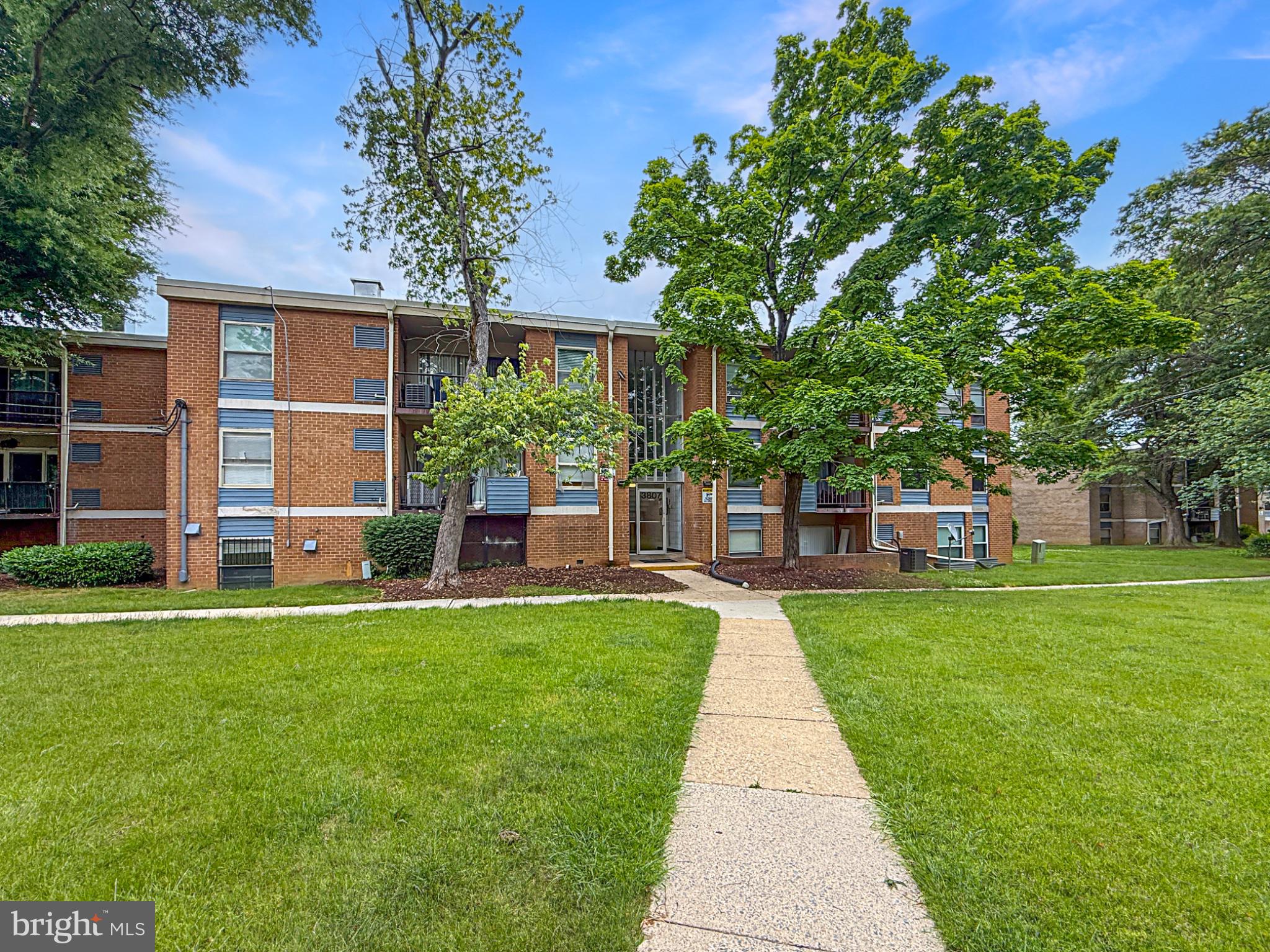 3807 St Barnabas Road, Unit 203 Suitland, MD 20746 - Photo 21 of 23 Charming brick apartment with lush greenery.