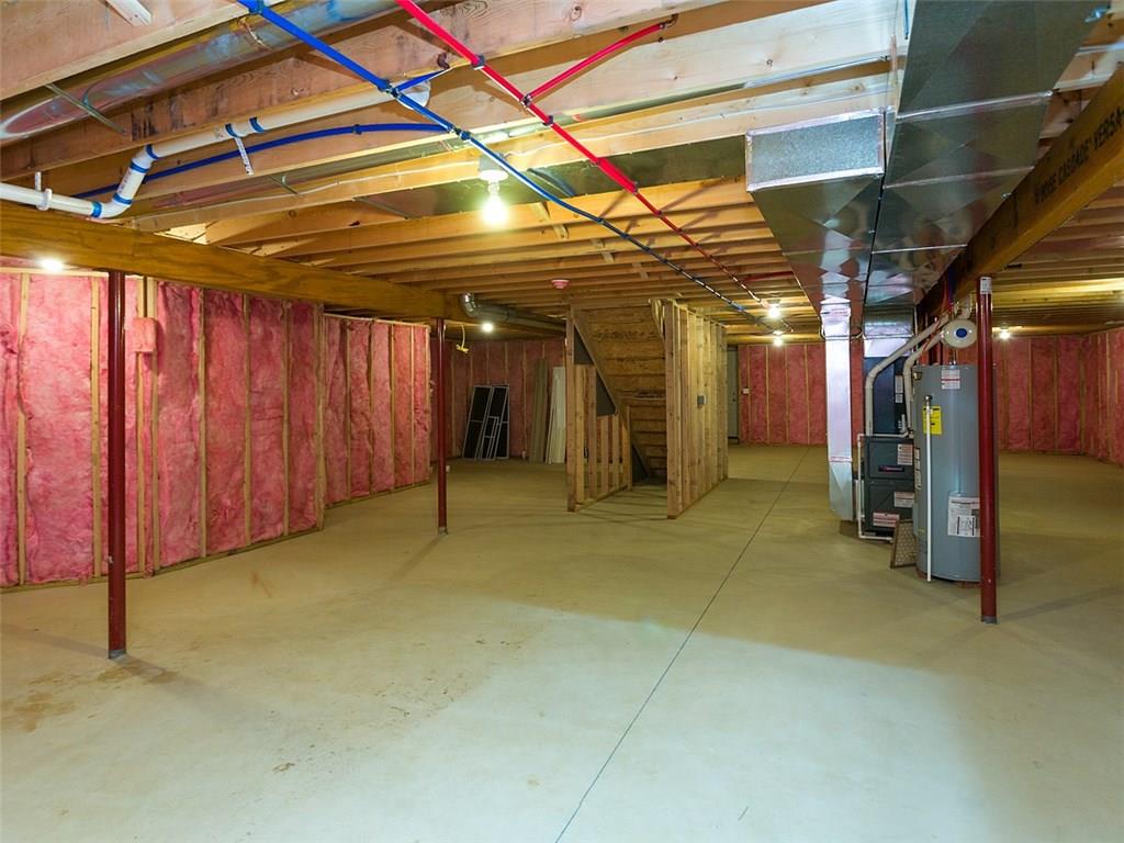 378 Lemmon Road Latrobe, PA 15650 - Photo 22 of 25 UNFINISHED LARGE BASEMENT FOR FUTURE COMPLETION AND OR STORAGE. AMANA HIGH EFFICIENT GAS FORCED AIR FURNACE AND HOT WATER HEATER. THERE ARE PROVISIONS FOR A FULL BATH TO ADD ALSO