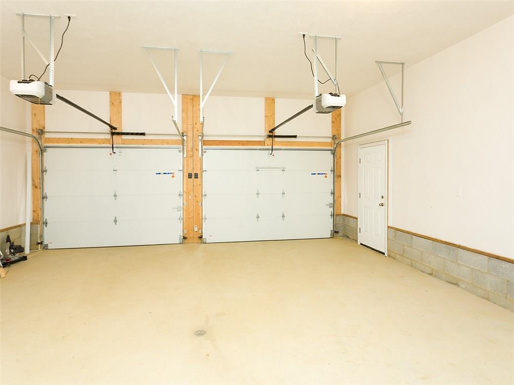 378 Lemmon Road Latrobe, PA 15650 - Photo 24 of 25 ATTACHED GARAGE, INSULATED GARAGE DOORS, LIFTMASTER BELT DRIVEN ELECTRIC OPENERS THAT CAN OPERATE FROM VEHICLES AND VIEW OF THE SIDE MAN DOOR