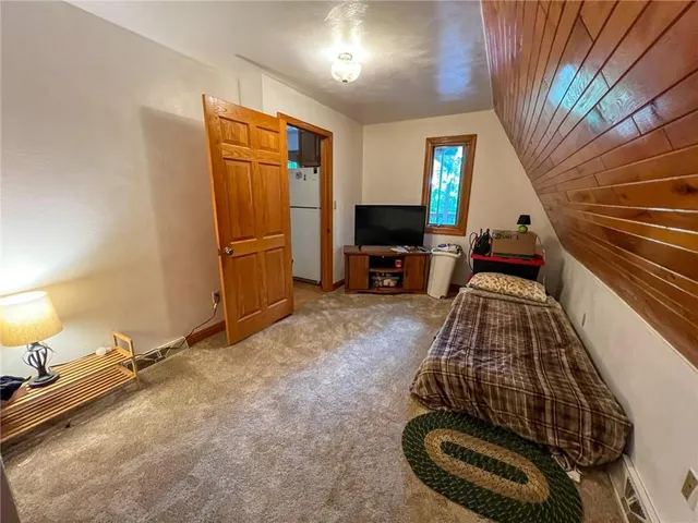 a view of a livingroom with furniture and a fireplace