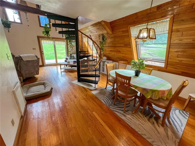 a backyard of a house with table and chairs