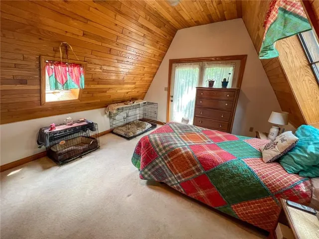 a bedroom with bed and a window