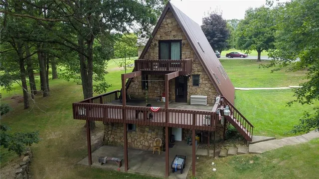a view of balcony with wooden floor and fence