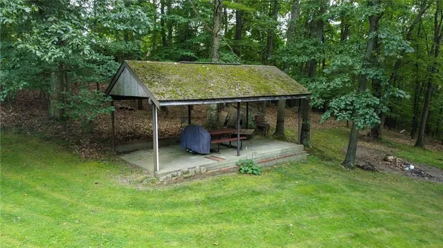 a red car parked in front of a house