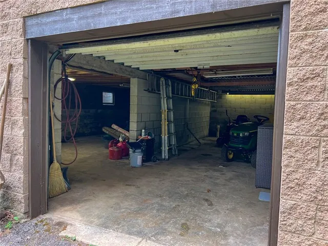 an aerial view of a house with garden space and street view