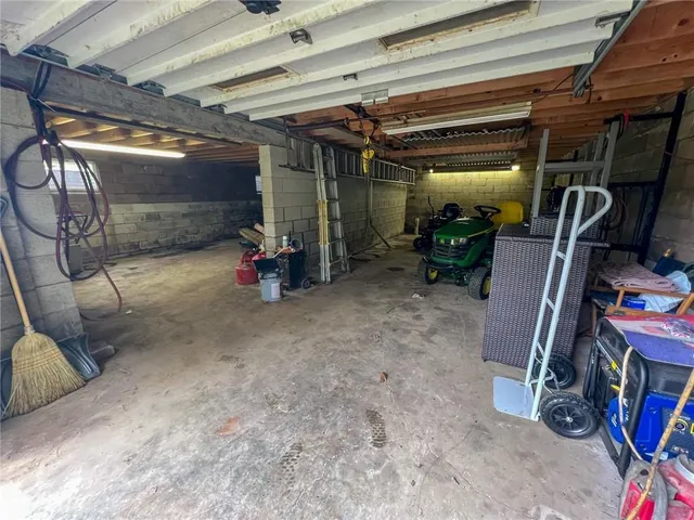 an aerial view of a house with pool yard and outdoor seating