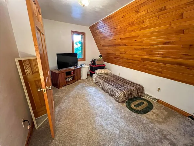 a view of a livingroom with furniture and a flat screen tv