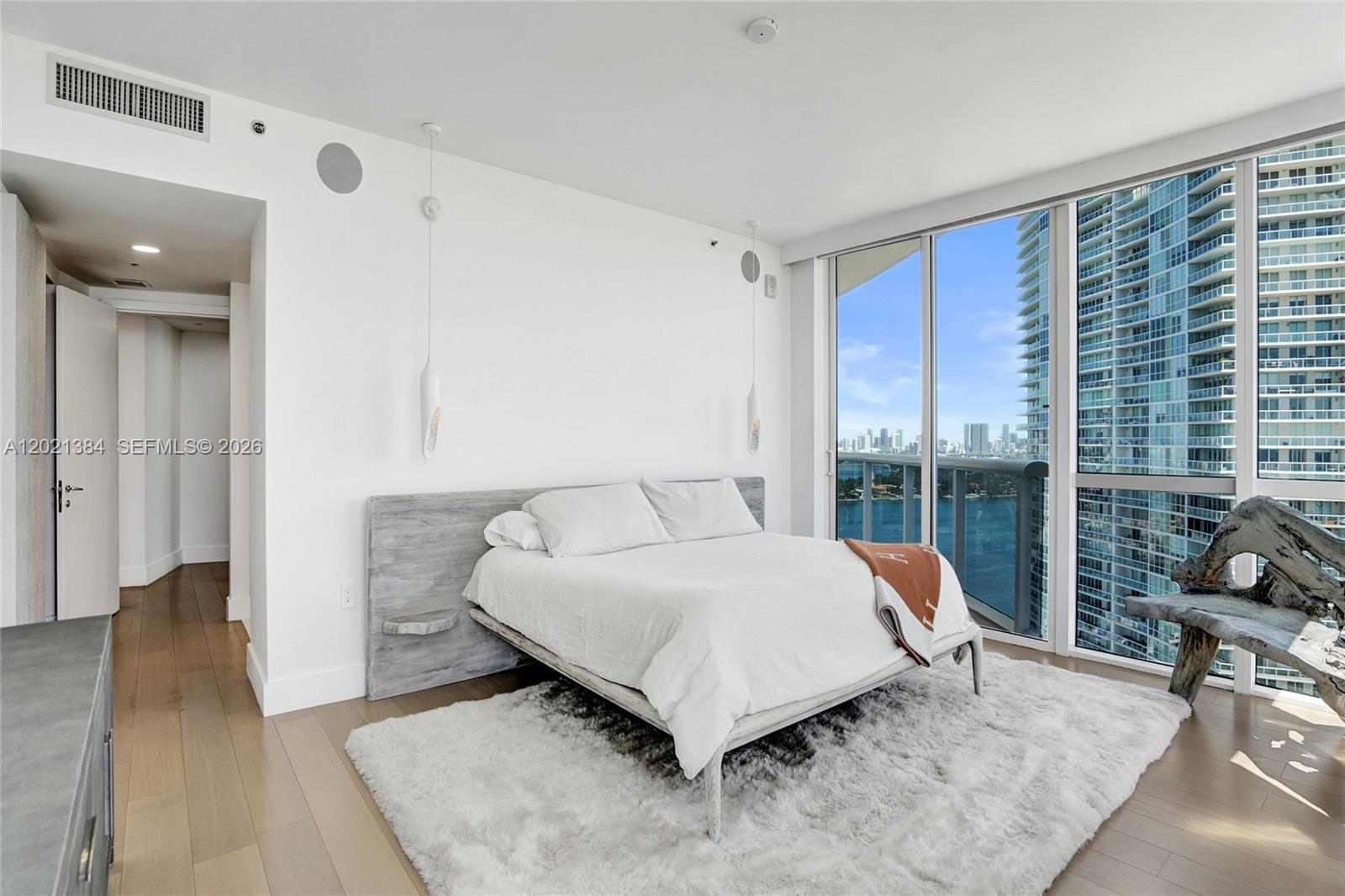 400 Alton Road, Unit PH11 Miami Beach, FL 33139 - Photo 25 of 49 a bedroom with a bed and glass window