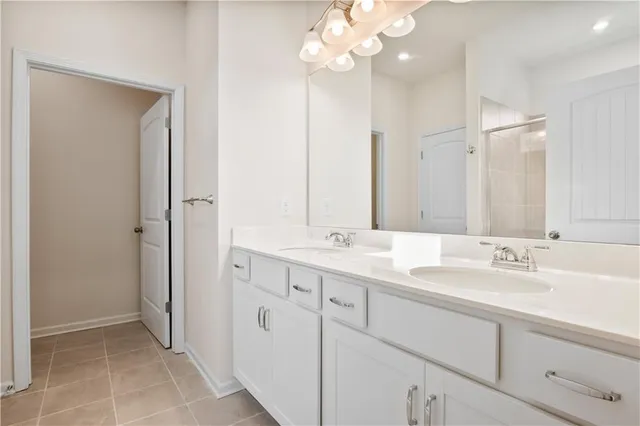 a bathroom with a double vanity sink mirror and double