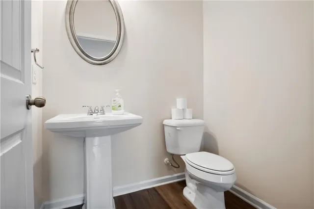 a bathroom with a sink a mirror and a toilet