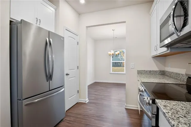 a kitchen with a refrigerator and a refrigerator