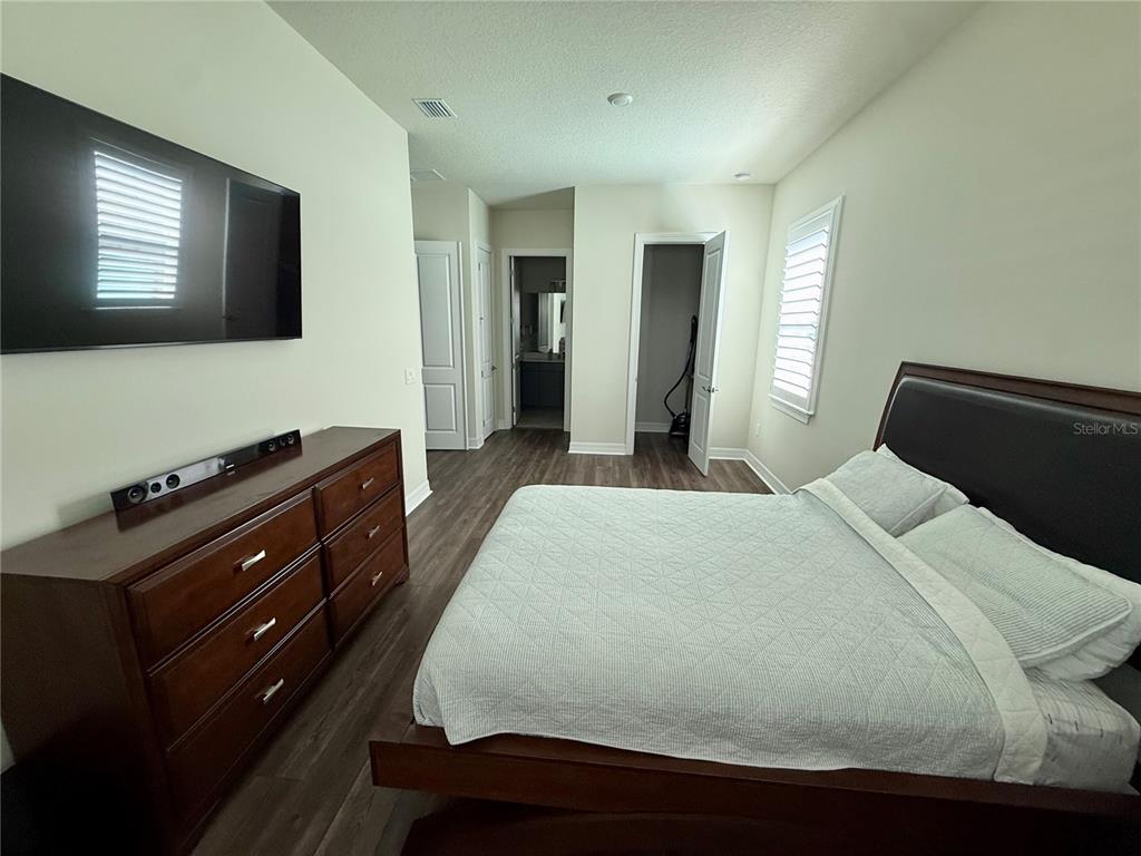 8441 Pk Clf Way Orlando, FL 32836 - Photo 48 of 59 a bedroom with a bed and a flat screen tv