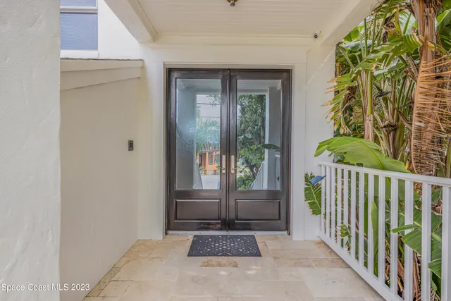 a kitchen with granite countertop a refrigerator stove and cabinets