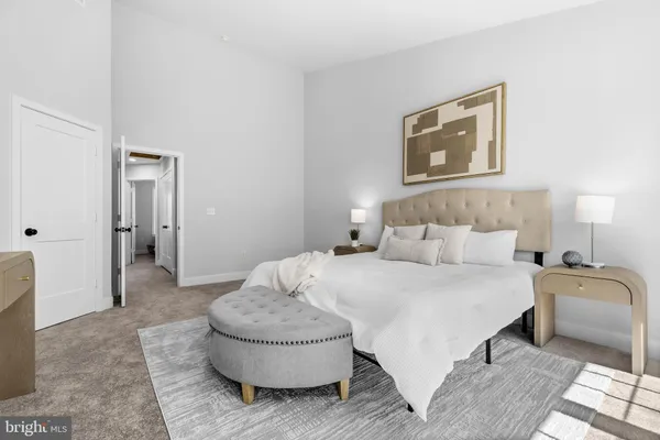 a bedroom with a bed and a couch