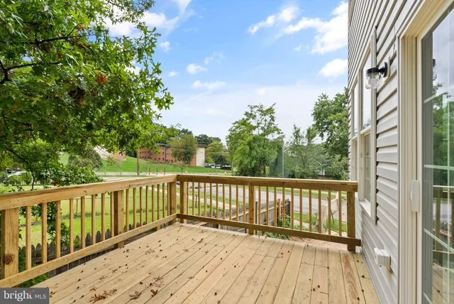 a view of balcony with wooden floor