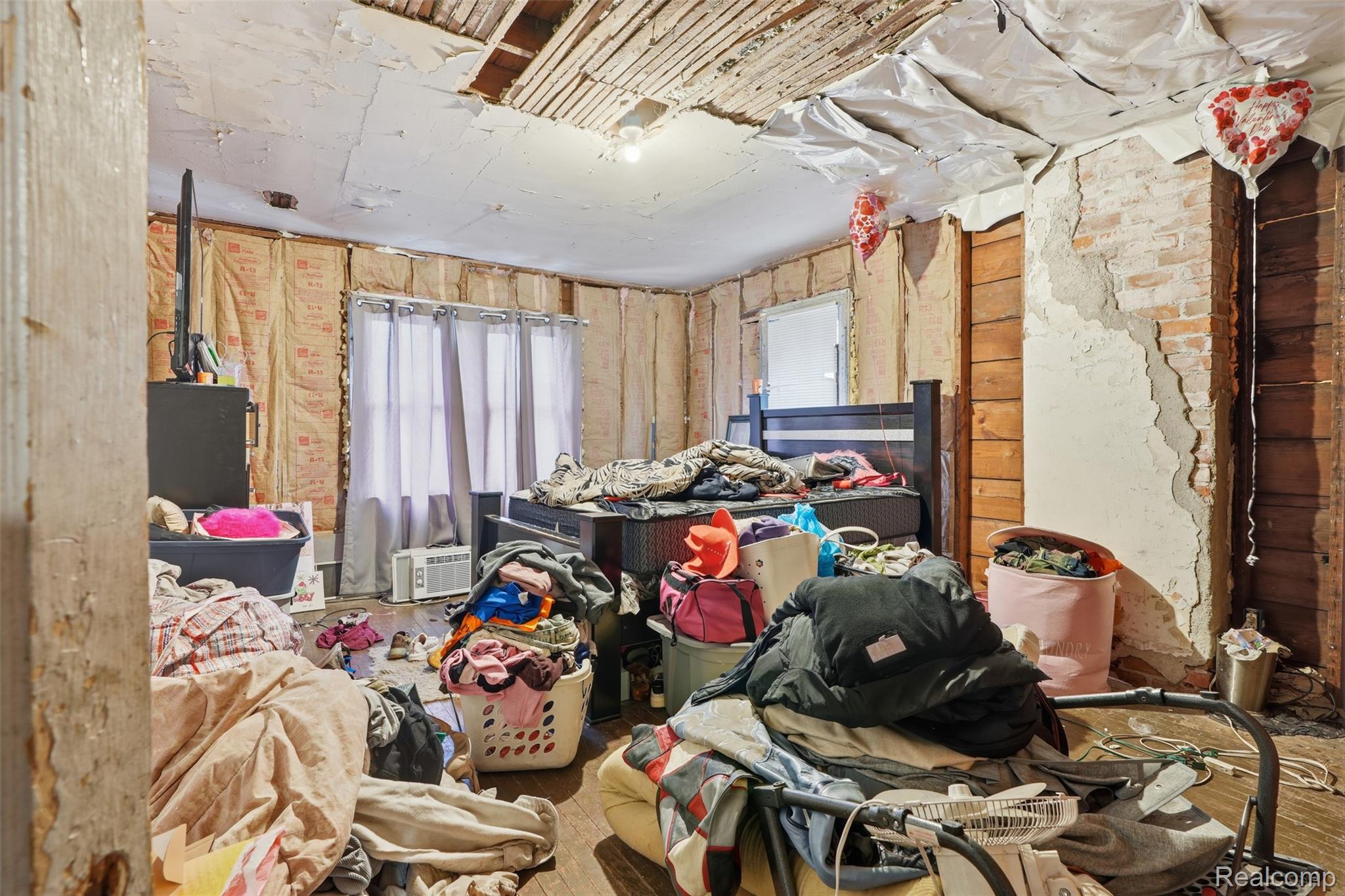 2500 Atkinson Street Detroit, MI 48206 - Photo 13 of 21 Bedroom featuring wood-type flooring and multiple windows