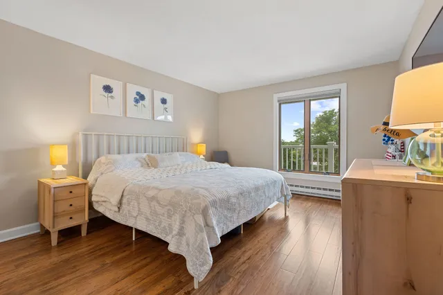 a bed room with a bed and a window