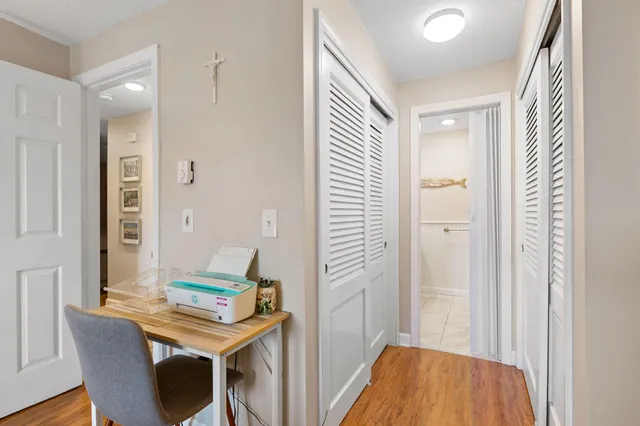 a view of a room with furniture and window