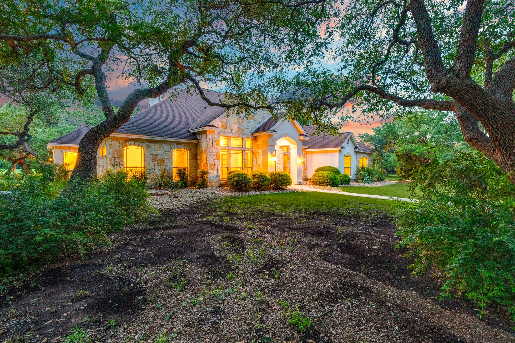101 Copper Leaf Court Georgetown, TX 78633 - Photo 3 of 31 Stone and stucco exterior with multiple gables and arched window details