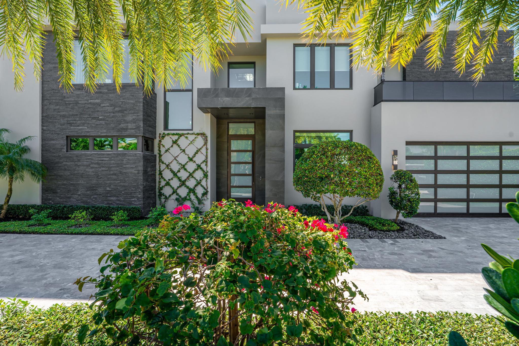 520 Northeast 4th Lane Boca Raton, FL 33432 - Photo 3 of 40 a front view of a house with garden