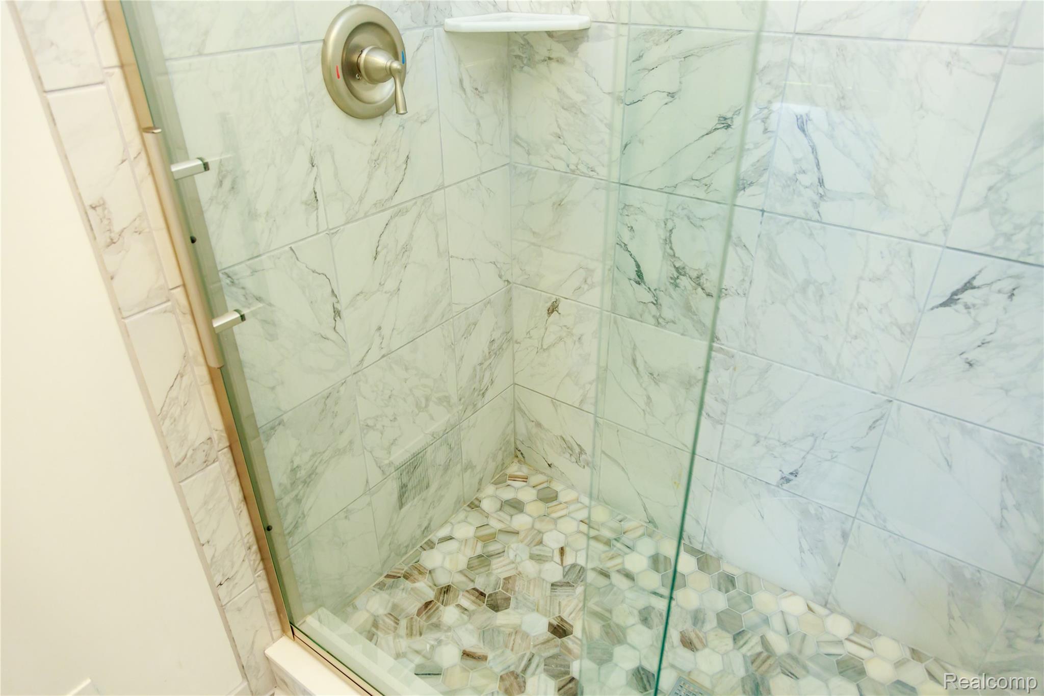 716 Eton Court Rochester, MI 48307 - Photo 16 of 41 New shower with marble floor