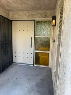 a view of a door with wooden wall