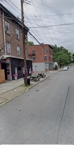a view of a building with sitting area