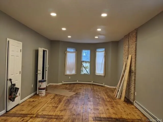 an empty room with large windows