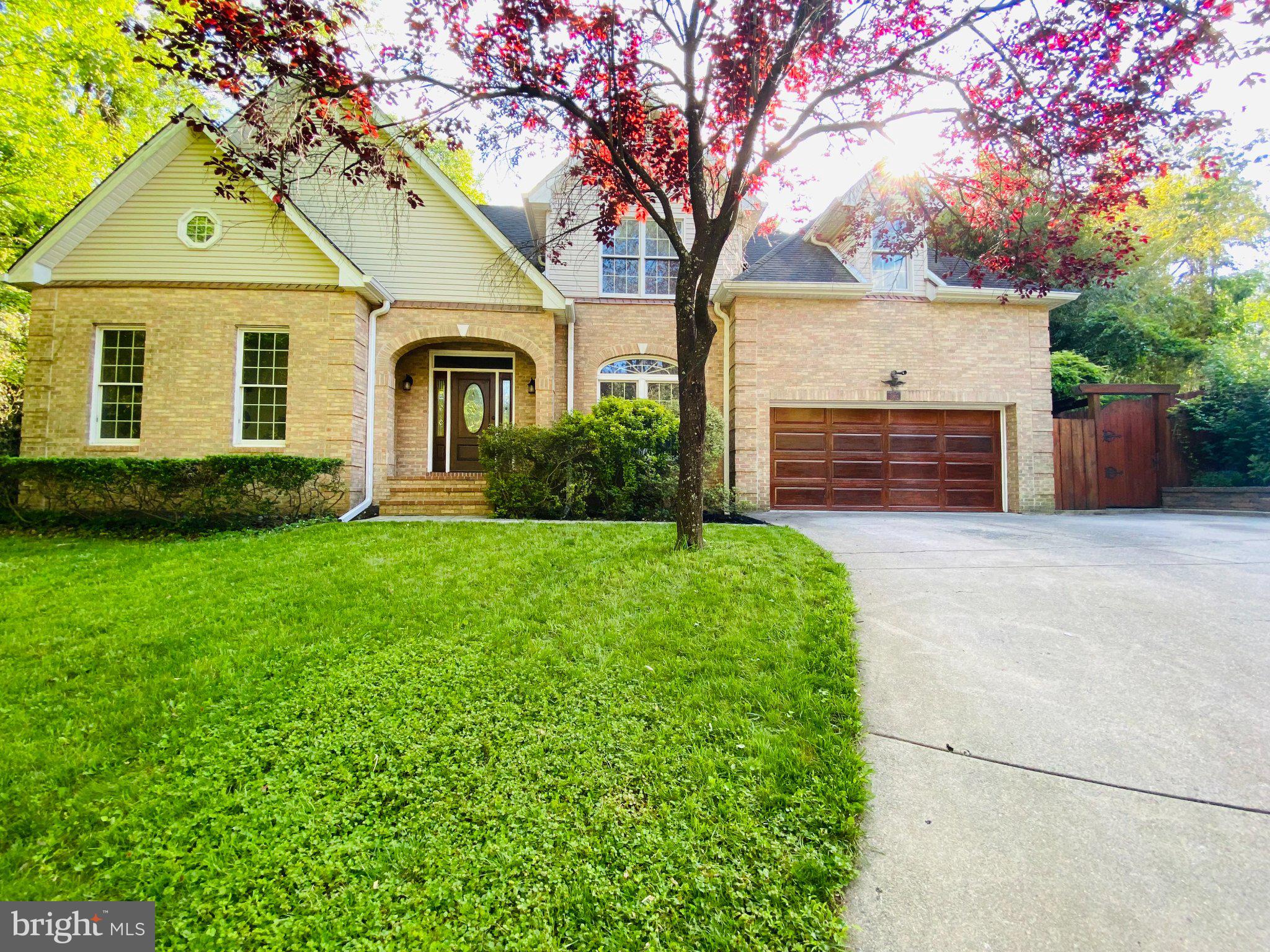 15802 Radwick Lane Silver Spring, MD 20906 - Photo 1 of 1 Charming brick home with lush greenery.