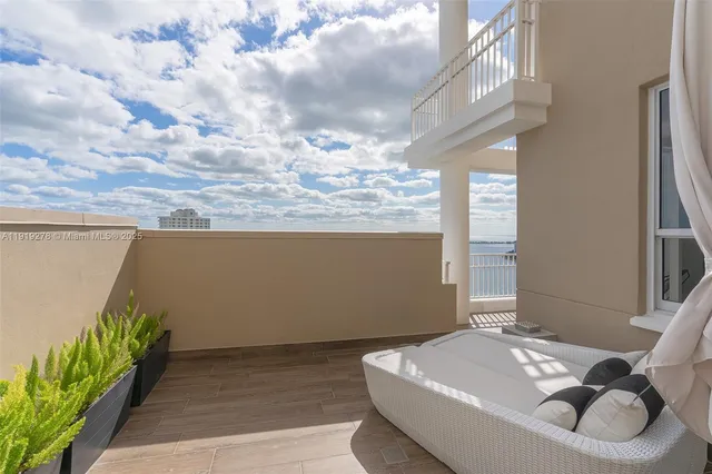 a view of balcony with furniture