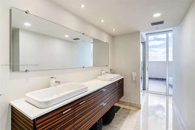 a bathroom with a sink double vanity and a mirror