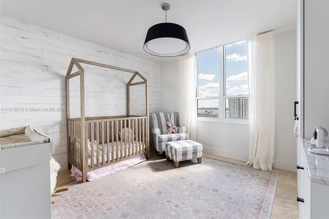 a bed room with a bed and a window