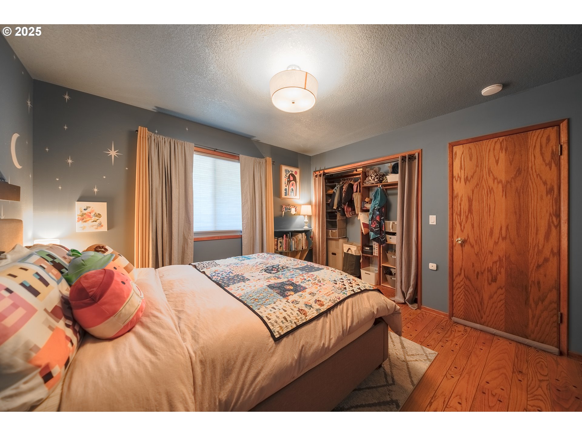 92693 T T Larson Road Astoria, OR 97103 - Photo 21 of 40 a bedroom with a bed and a large mirror