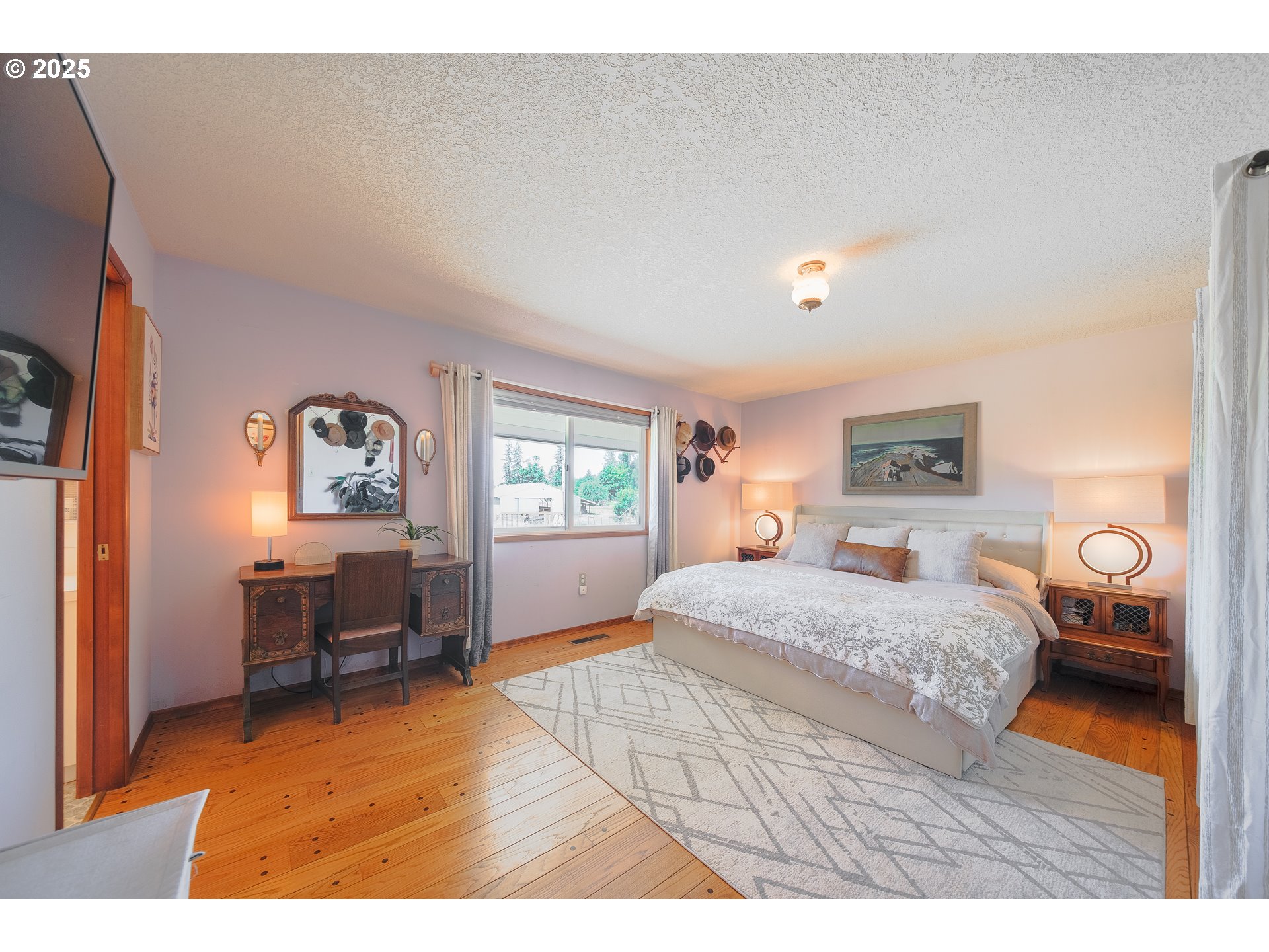 92693 T T Larson Road Astoria, OR 97103 - Photo 24 of 40 a bedroom with a bed and wooden floor