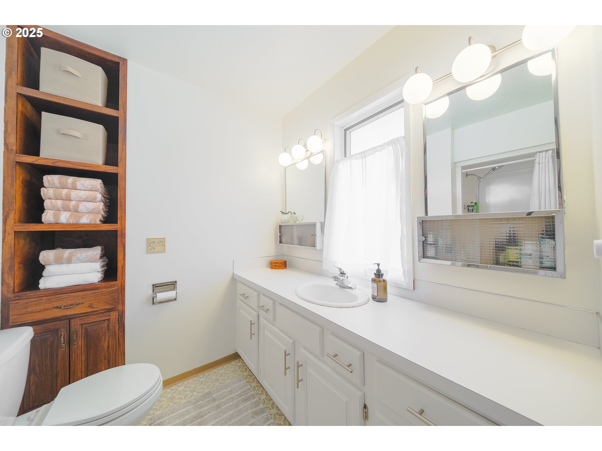 92693 T T Larson Road Astoria, OR 97103 - Photo 29 of 40 a bathroom with a sink a toilet and a mirror